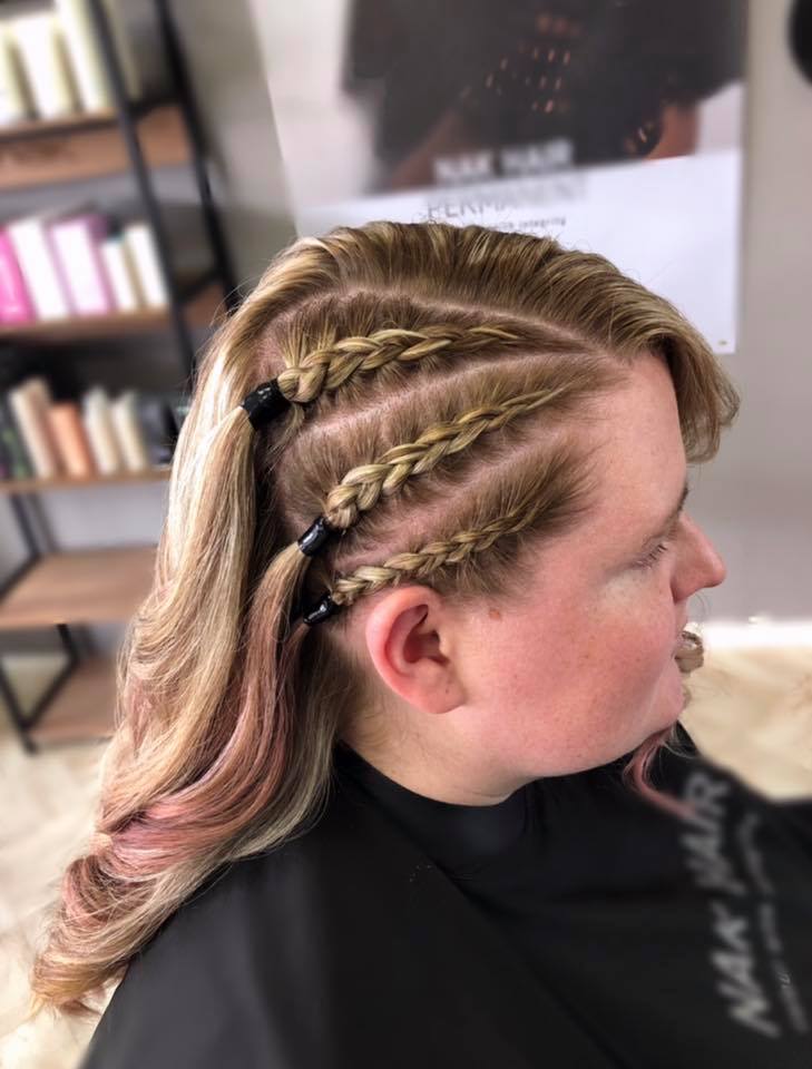 Three braids on the side of a client’s head at Nate’s Hair