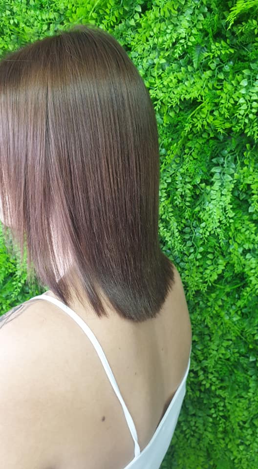 Sleek straight brunette hair with subtle colour